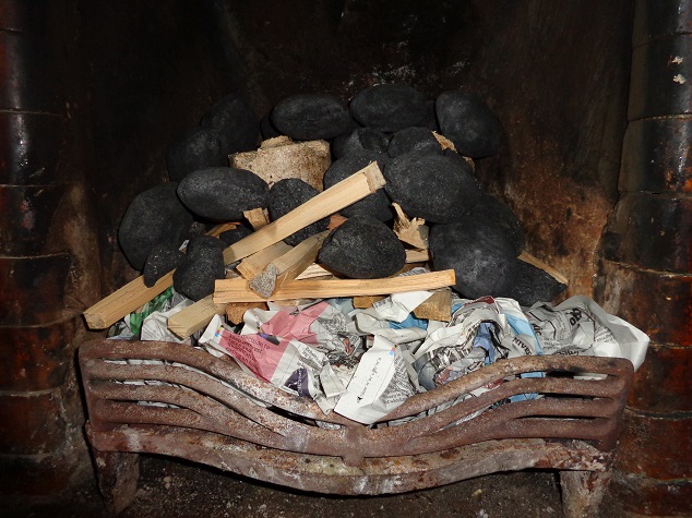 Fire with kindling and coal set 