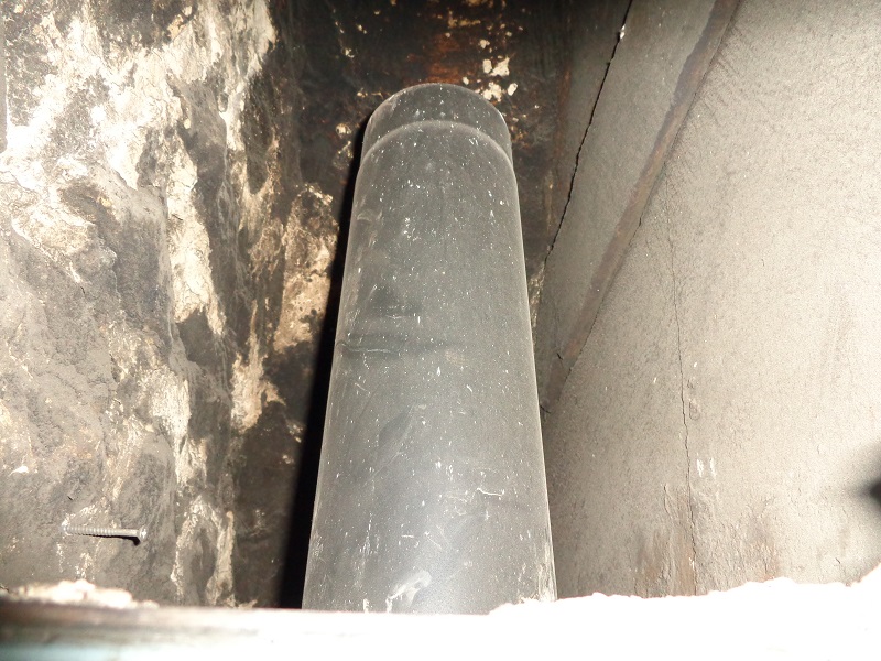 flue pipe adjacent to combustible fire surround